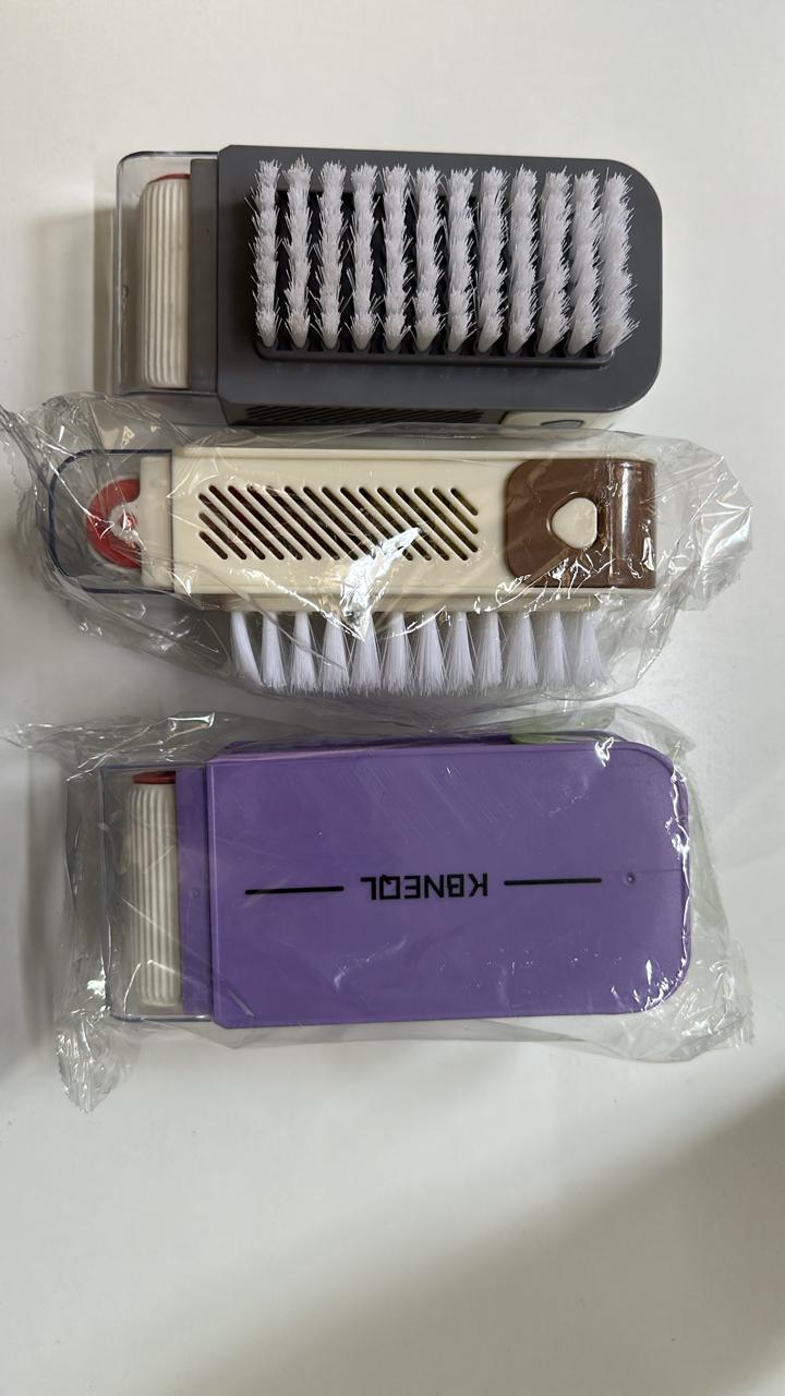 Wukusy liquid dispensing cleaning brush with built-in soap dispenser, color may vary, suitable for home cleaning tasks.