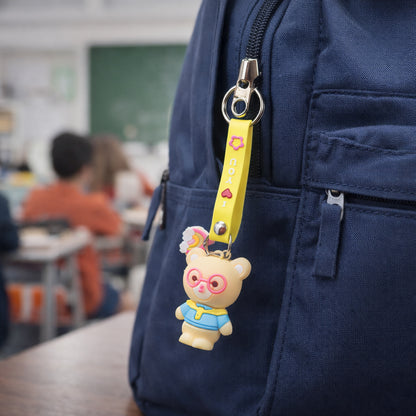 Cute cartoon teddy bear keychain with yellow "I Love You" strap by Wukusy, featuring a soft plush teddy bear and colorful strap.