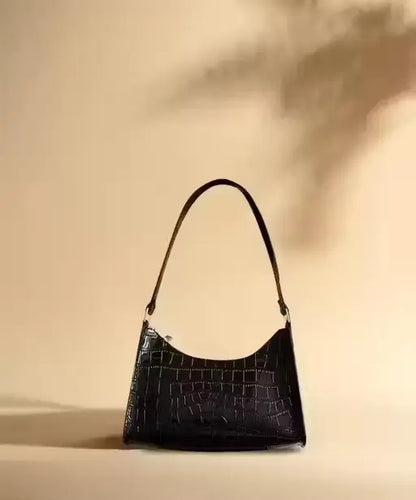 Textured faux leather sling bag for women by Ekom, stylish crossbody bag with adjustable strap and compact design.