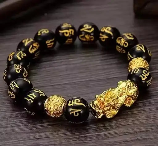 Black and golden Ekom Lucky Bracelet with Pixiu charm, designed for health and household care, featuring intricate detailing.