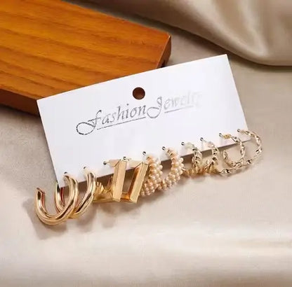 Set of 17 girls' metal earrings including studs, various designs, by Ekom, perfect for jewelry and watches collection