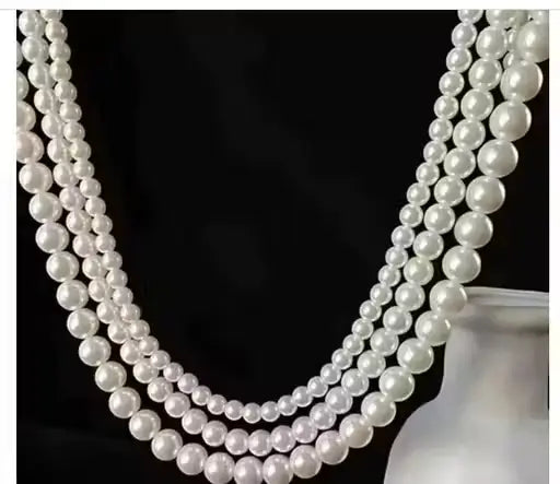Ekom Elegants multi-layer off-white pearl necklace for women, stylish jewelry with layered pearl design.