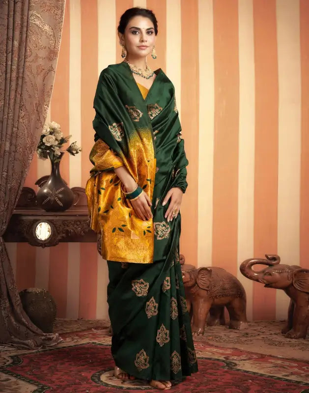 Elegant green and gold silk saree for women from Ekom's Royal Green Golden Elegance Collection, featuring intricate designs and luxurious fabric.
