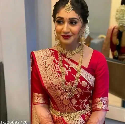 Red silk saree from Ekom's Bridal Royal Banarasi Collection, featuring intricate traditional embroidery for women.