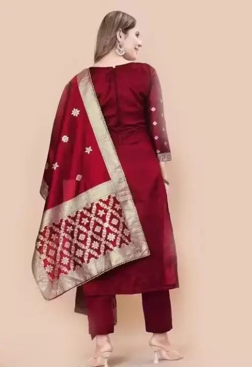 Red art silk unstitched salwar suit set for women from Ekom's party wear collection, featuring zari woven design and elegant style.