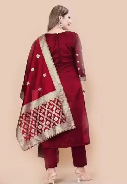 Red art silk unstitched salwar suit set for women from Ekom's party wear collection, featuring zari woven design and elegant style.