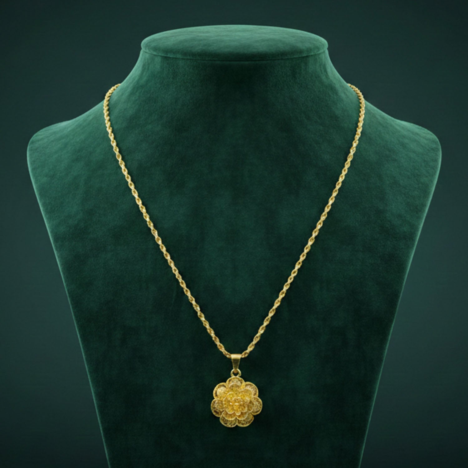 Gold plated pendant necklace with elegant floral design by Wukusy, featuring intricate detailing and a delicate chain.