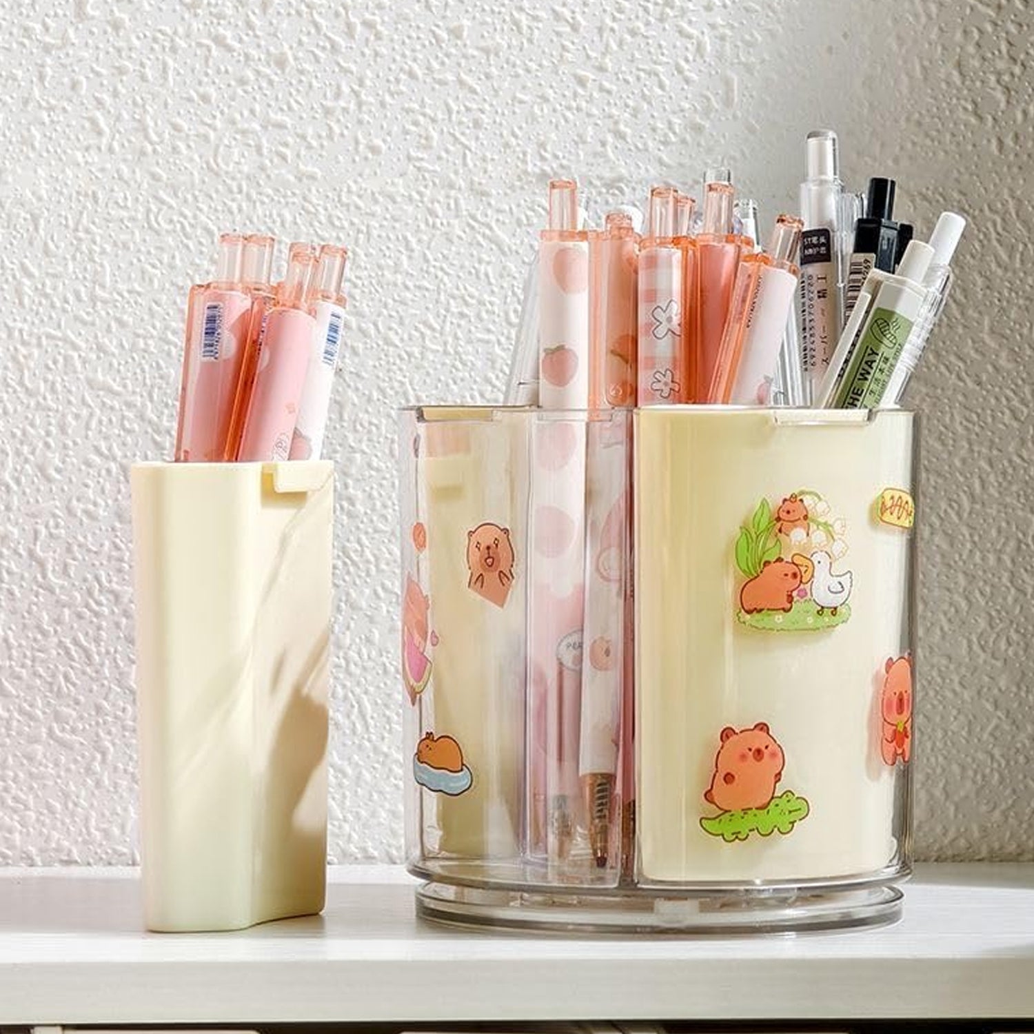 Wukusy 5-compartment rotating pen holder on desk, includes space for pens, pencils, and office supplies in a sleek desktop organizer.