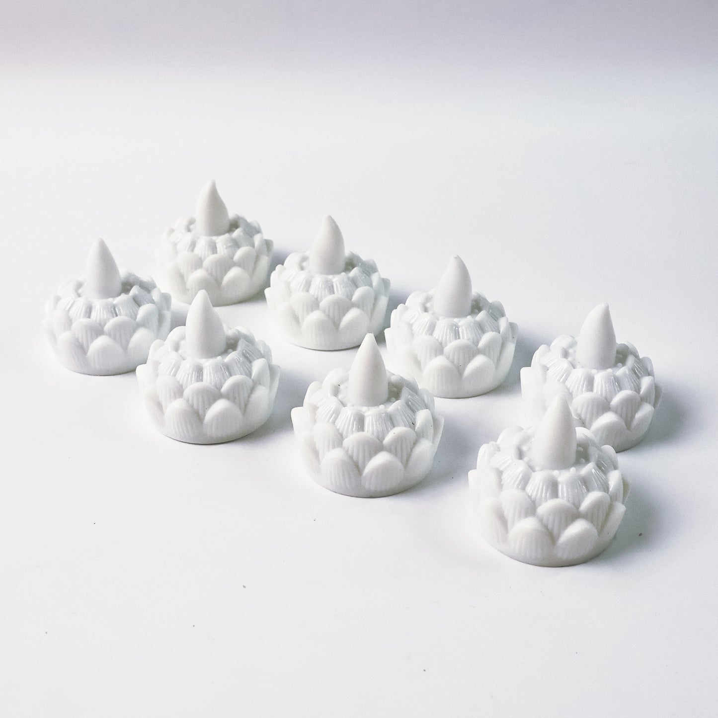 Set of 8 lotus-shaped LED flameless tealight candles by Wukusy, perfect for elegant home decor and ambient lighting.