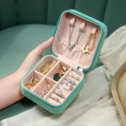 Wukusy mini portable jewelry box for women with leather exterior, ideal for rings, earrings, necklaces, and travel jewelry storage