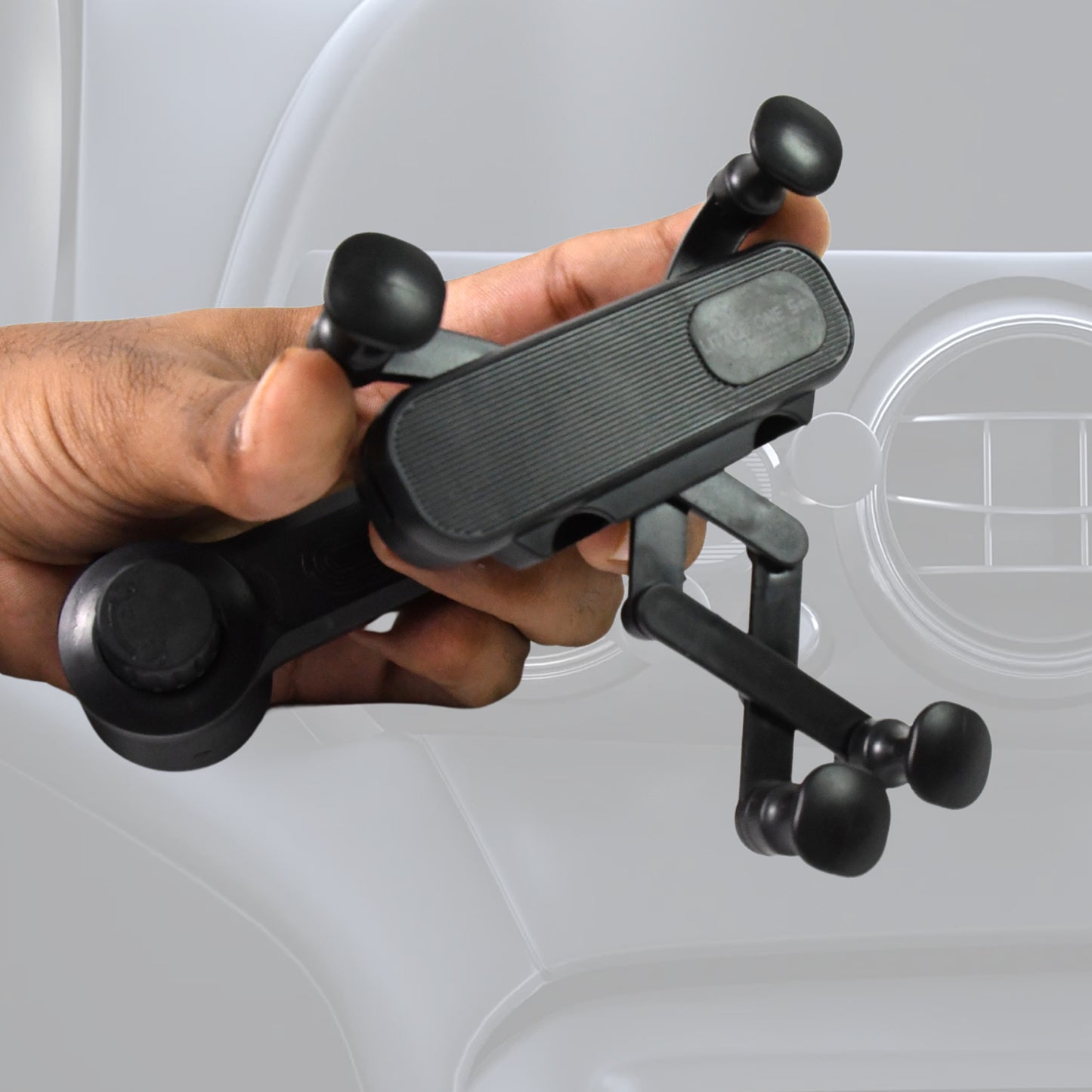 Wukusy 360-degree car phone holder with adjustable grip for secure mounting of mobile phones inside vehicle.