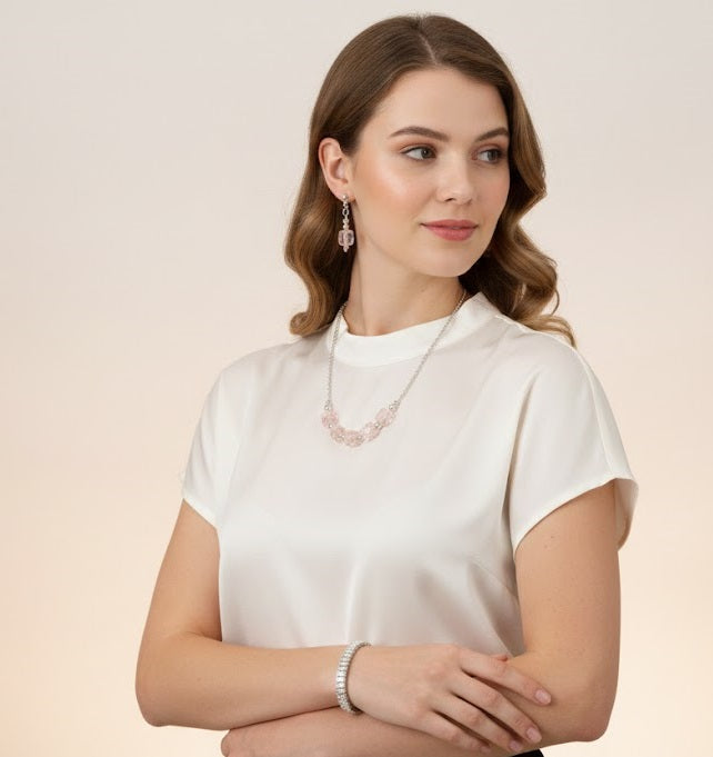 Silver plated artificial stones studded jewellery set with intricate design, featuring earrings and a matching necklace.
