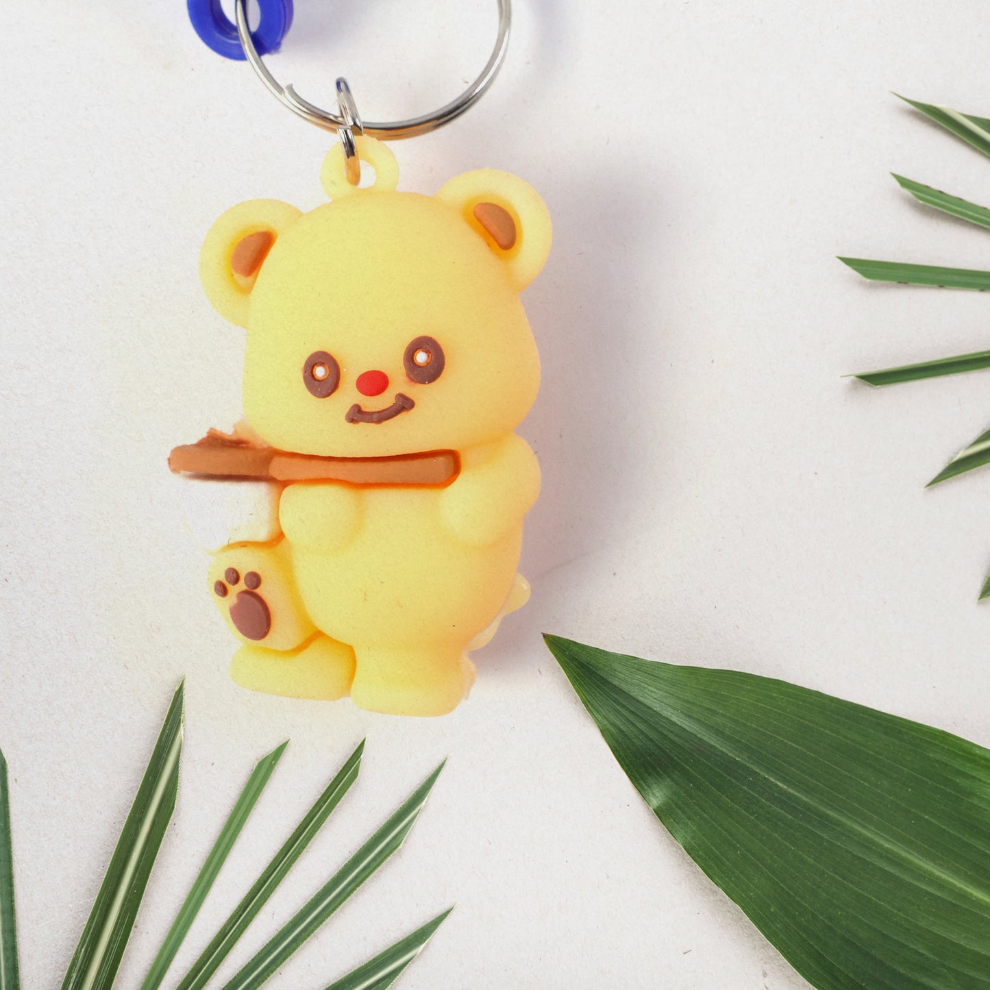 Wukusy cute bear character keychain featuring a plush bear with a smiling face and small paws, ideal for accessories or bags.