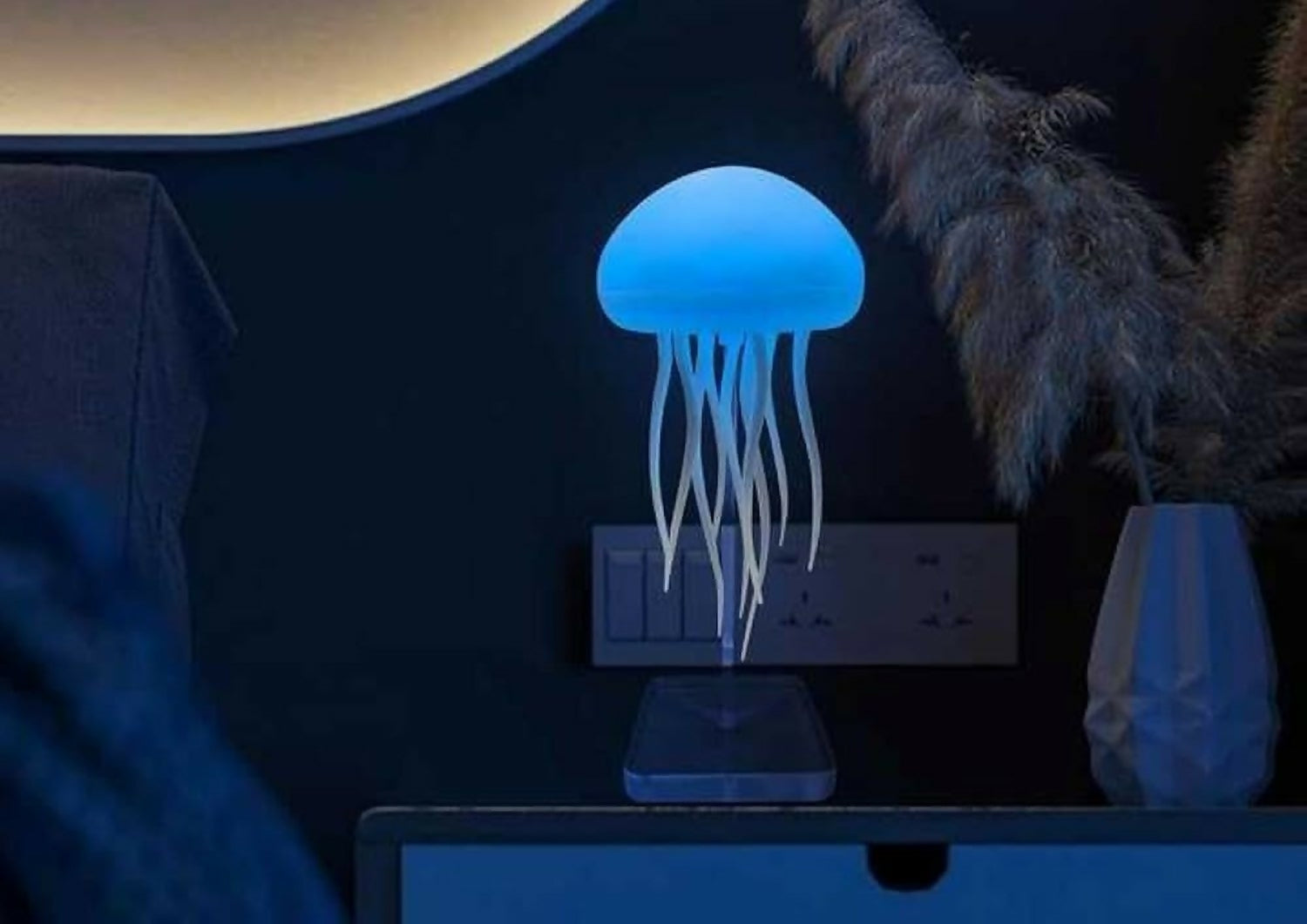 Warm Jellyfish Night Light Lamp by Wukusy emitting a soft ambient glow for home decor and cozy nighttime illumination.