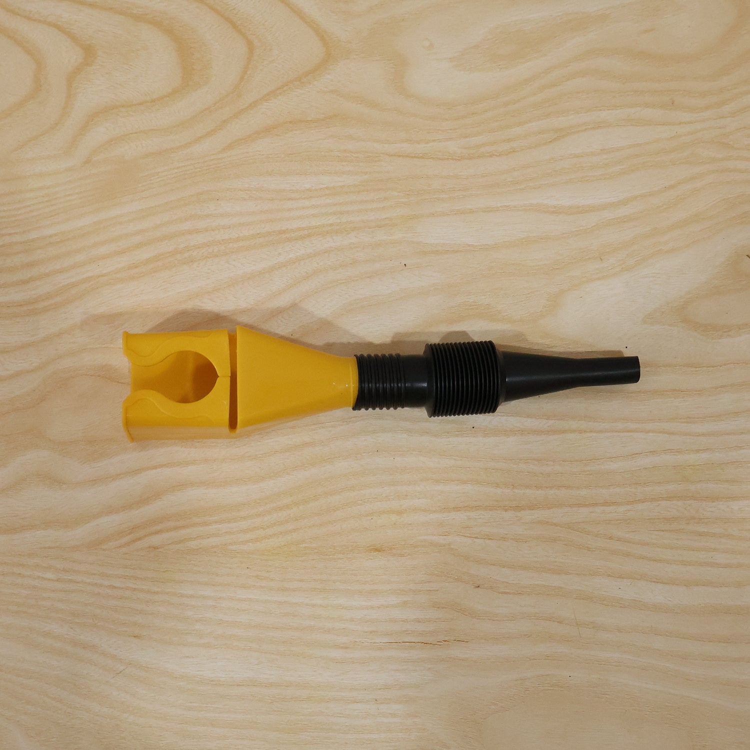 Wukusy flexible plastic funnel for spill-free car oil and fuel filling, shown in use with a car engine.