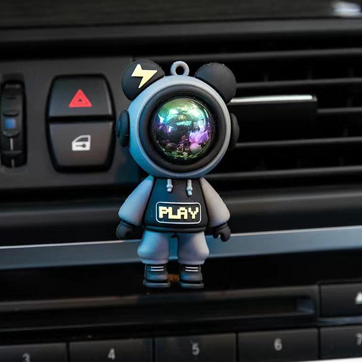 Wukusy cute astronaut car air freshener with vent clip, featuring a playful astronaut figure, hanging in a car interior.