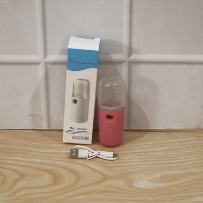 Portable Wukusy mini nano mist sprayer face steamer with USB rechargeable humidifier, compact and handheld for skincare use.