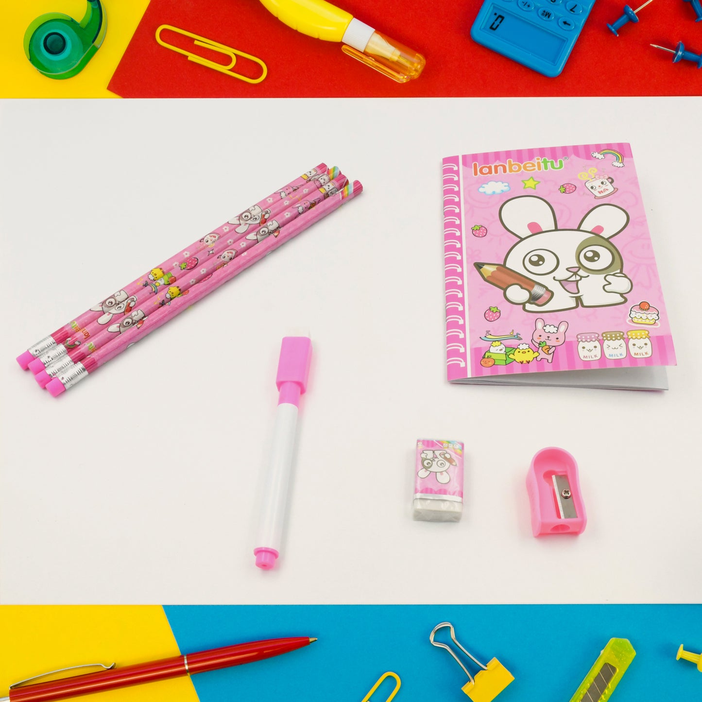 Wukusy stationery kit for kids with wooden pencil sharpener, eraser, small diary, and school supplies in an 8-piece set.