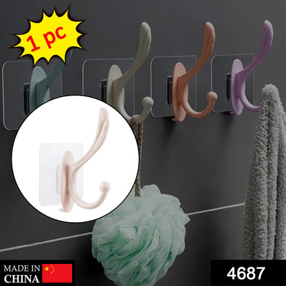 Wukusy 4687 self-adhesive plastic wall hook mounted on a wall for home organization and hanging items