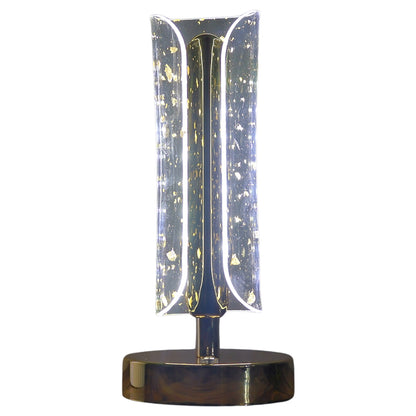 Wukusy crystal table lamp with a clear glass base and a fabric lampshade, resting on a wooden surface.