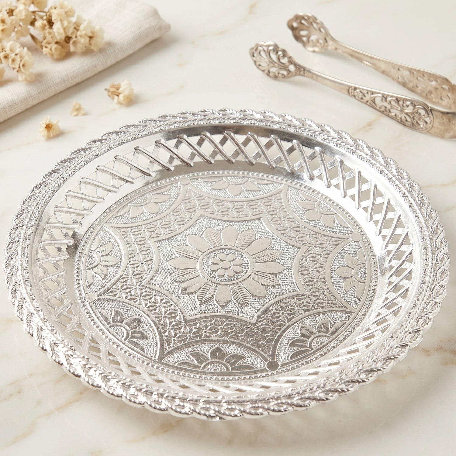 Elegant round silver serving tray with floral design by Wukusy, showcasing intricate decorative patterns and shiny metallic finish.
