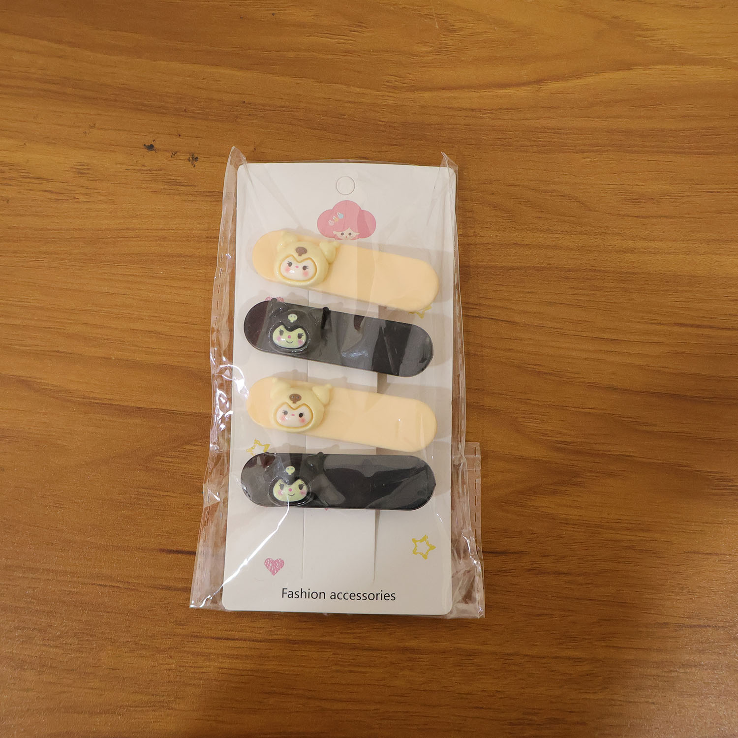 Set of four cute cartoon character decorative hair clips by Wukusy, featuring colorful, playful designs for kids' hair accessories.