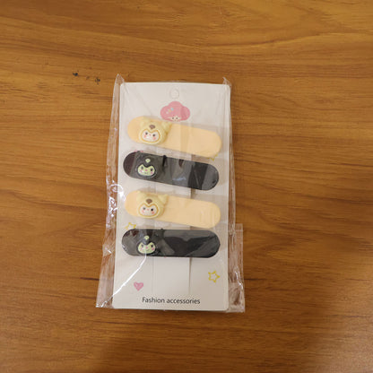Set of four cute cartoon character decorative hair clips by Wukusy, featuring colorful, playful designs for kids' hair accessories.