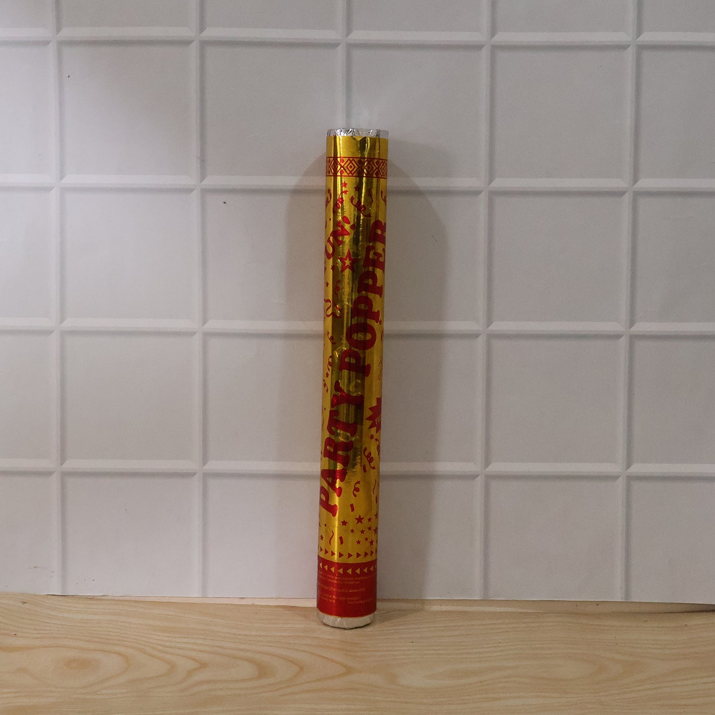 Wukusy golden party popper confetti cannon for birthdays and celebrations, ready to shoot colorful confetti in the air.