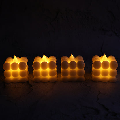 Set of four Wukusy decorative LED bubble candles for home decor, featuring glowing, textured bubble designs in a stylish display.