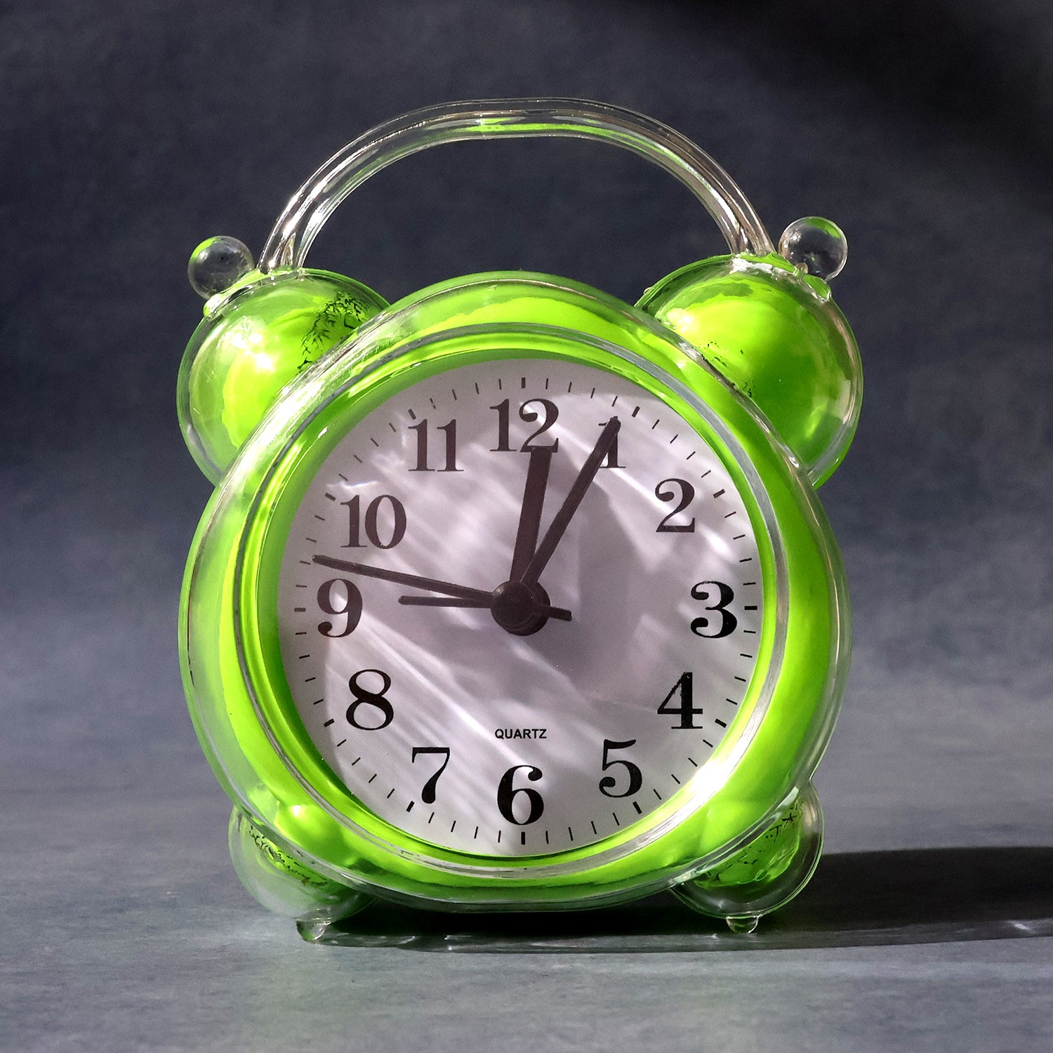 Wukusy classic quartz alarm clock with round white face, black numbers, and metal frame for home improvement.