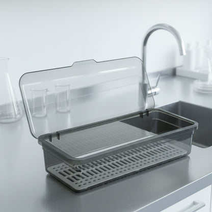 Wukusy multipurpose kitchen sink organizer tray, 27x12 cm, with compartments for utensils and sponges, placed in a kitchen sink.