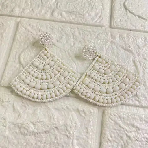 Handmade cone-shaped beaded earrings by Ekom featuring colorful, intricate beaded jewelry in a stylish fashion design.