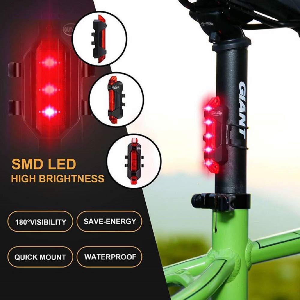 Wukusy 1561 rechargeable bicycle front waterproof LED light in red, mounted on a bike for visibility and safety.