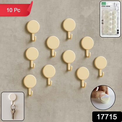 Set of 10 Wukusy self-adhesive round wall hooks for home improvement, shown attached to a wall for hanging items.
