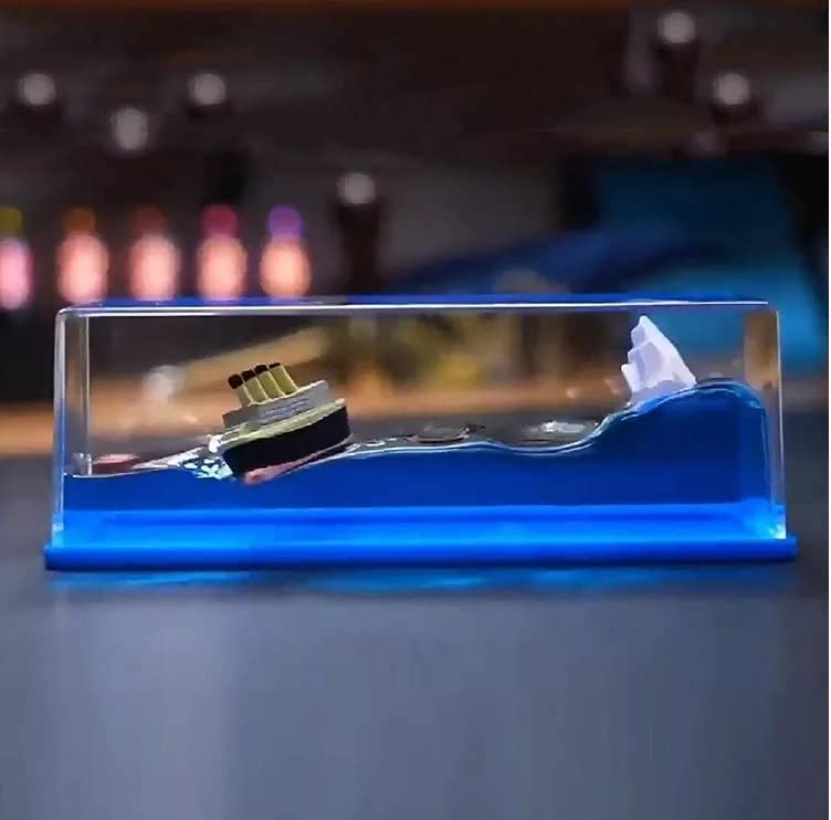 Titanic decorative ship model by FIZZI SHOP JK SIDHU featuring detailed white and blue design on a wooden base.