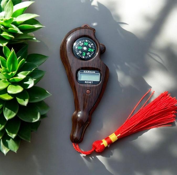 Digital finger counter with compass from FIZZI SHOP JK SIDHU, showing a compact device with digital display and built-in compass.