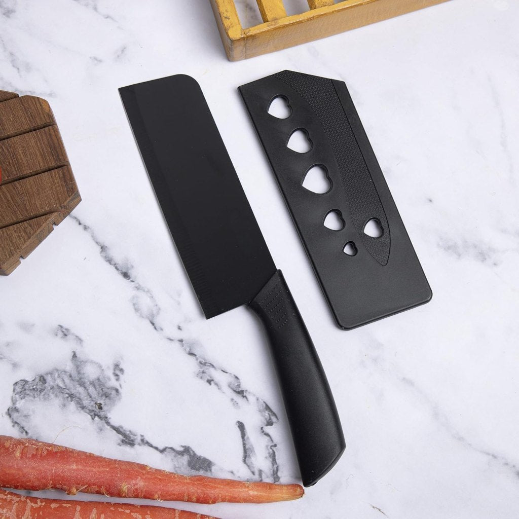 Set of three FIZZI SHOP JK SIDHU kitchen knives with stainless steel blades and ergonomic handles on a wooden surface.
