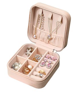 FIZZI SHOP JK SIDHU PU jewelry box with compartments and pink velvet lining for storing jewelry and accessories.