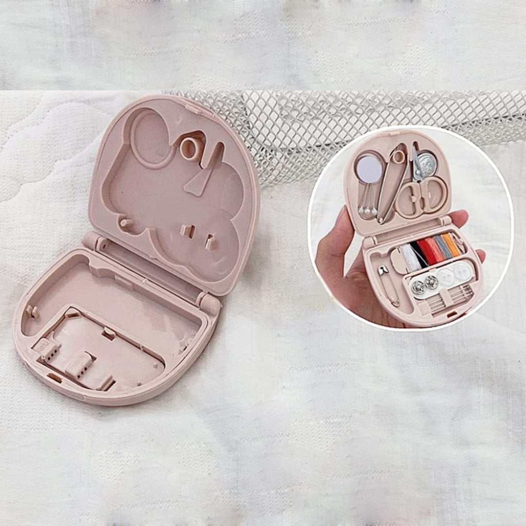 Mini travel sewing kit by FIZZI SHOP JK SIDHU with colorful threads, needles, and small sewing accessories in a compact case.