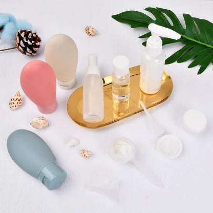 Set of 11 FIZZI SHOP travel bottles in various sizes with leak-proof caps, ideal for toiletries and liquids during travel.