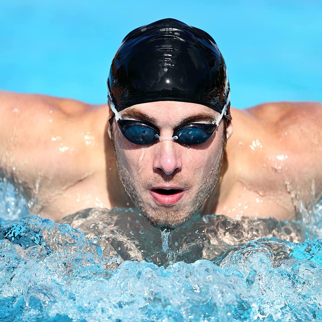Silicone swimming cap by FIZZI SHOP, smooth and flexible, designed to fit snugly on a swimmer’s head for optimal water protection.