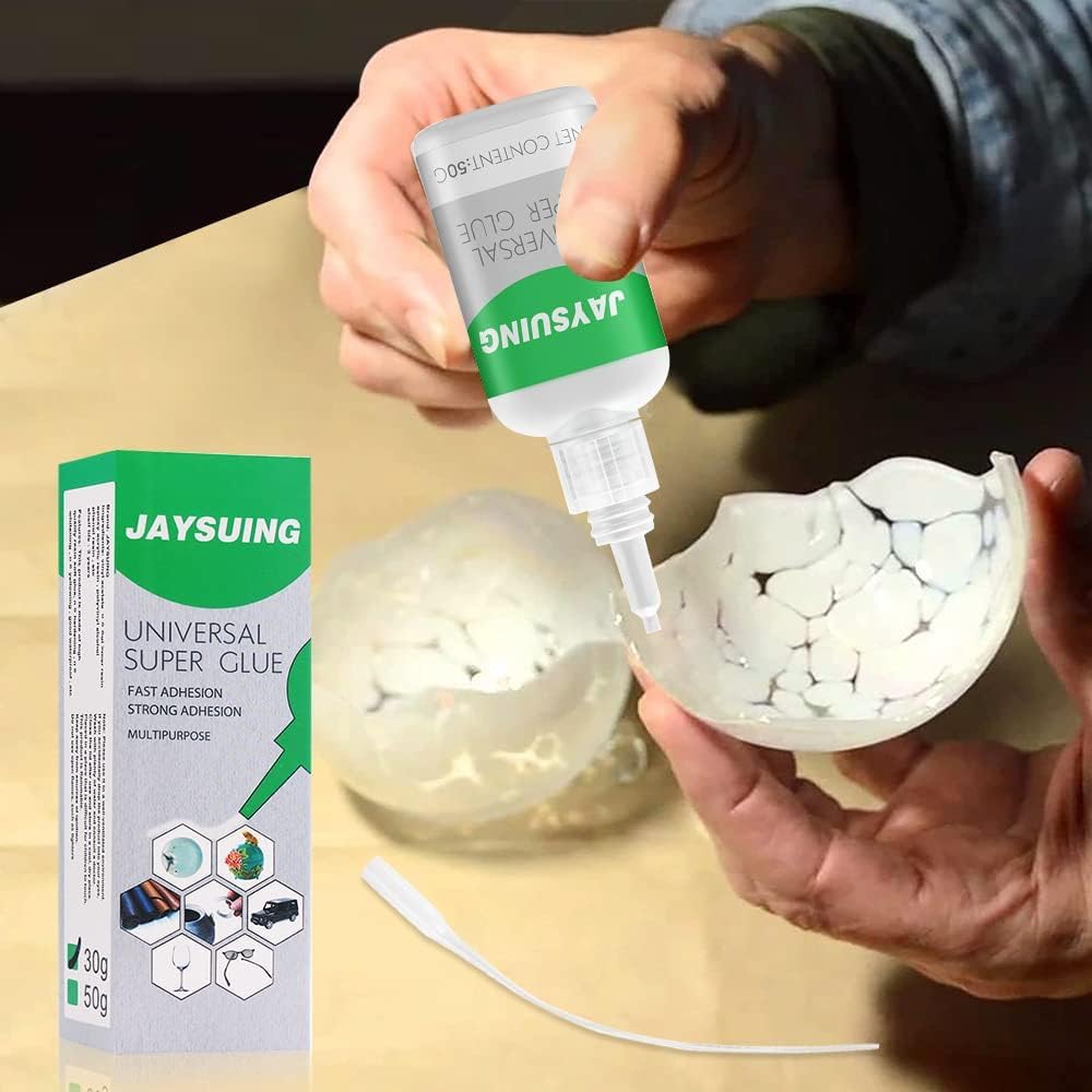 Universal super glue by FIZZI SHOP JK SIDHU, showing a clear tube of fast-acting adhesive with applicator tip.