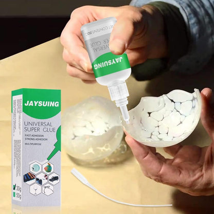 Universal super glue by FIZZI SHOP JK SIDHU, showing a clear tube of fast-acting adhesive with applicator tip.