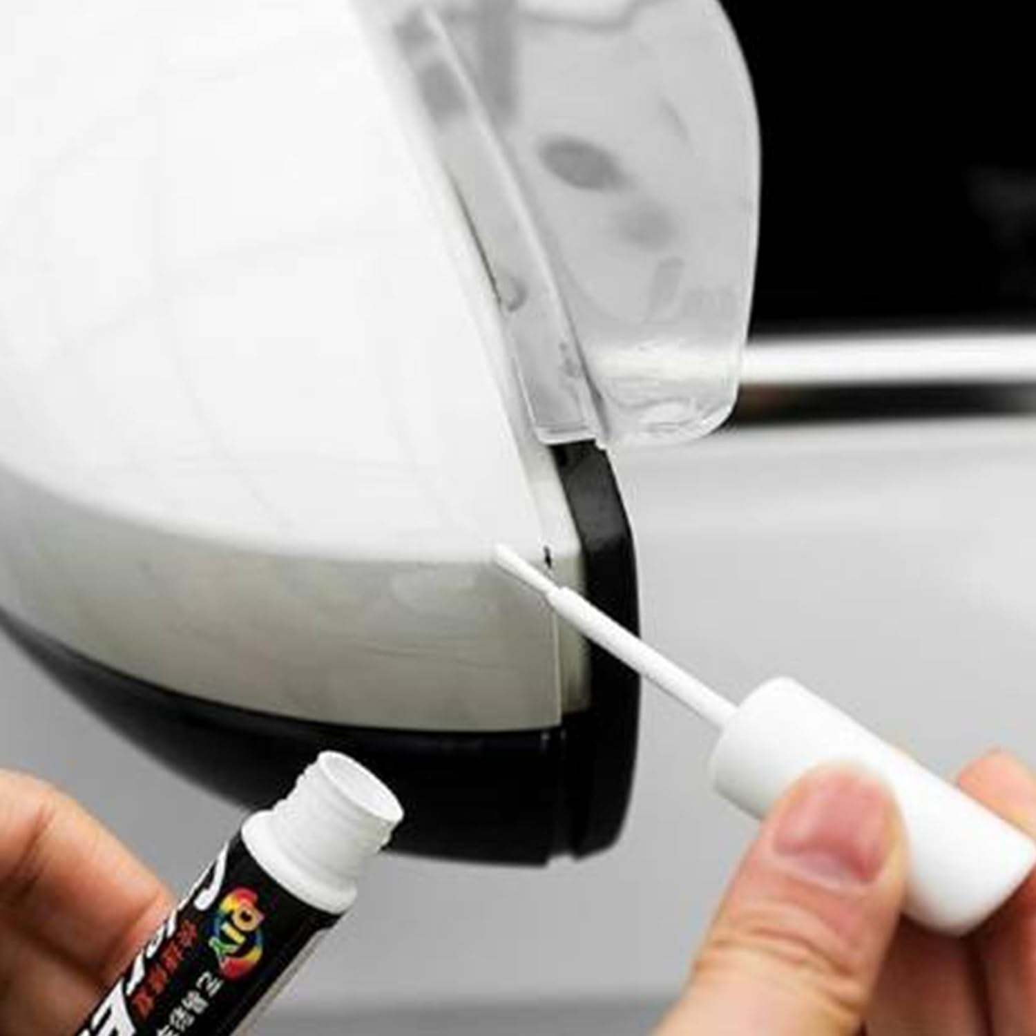 White car scratch repair paint pen by FIZZI SHOP JK SIDHU with a black cap, designed for touch-up and scratch concealment.