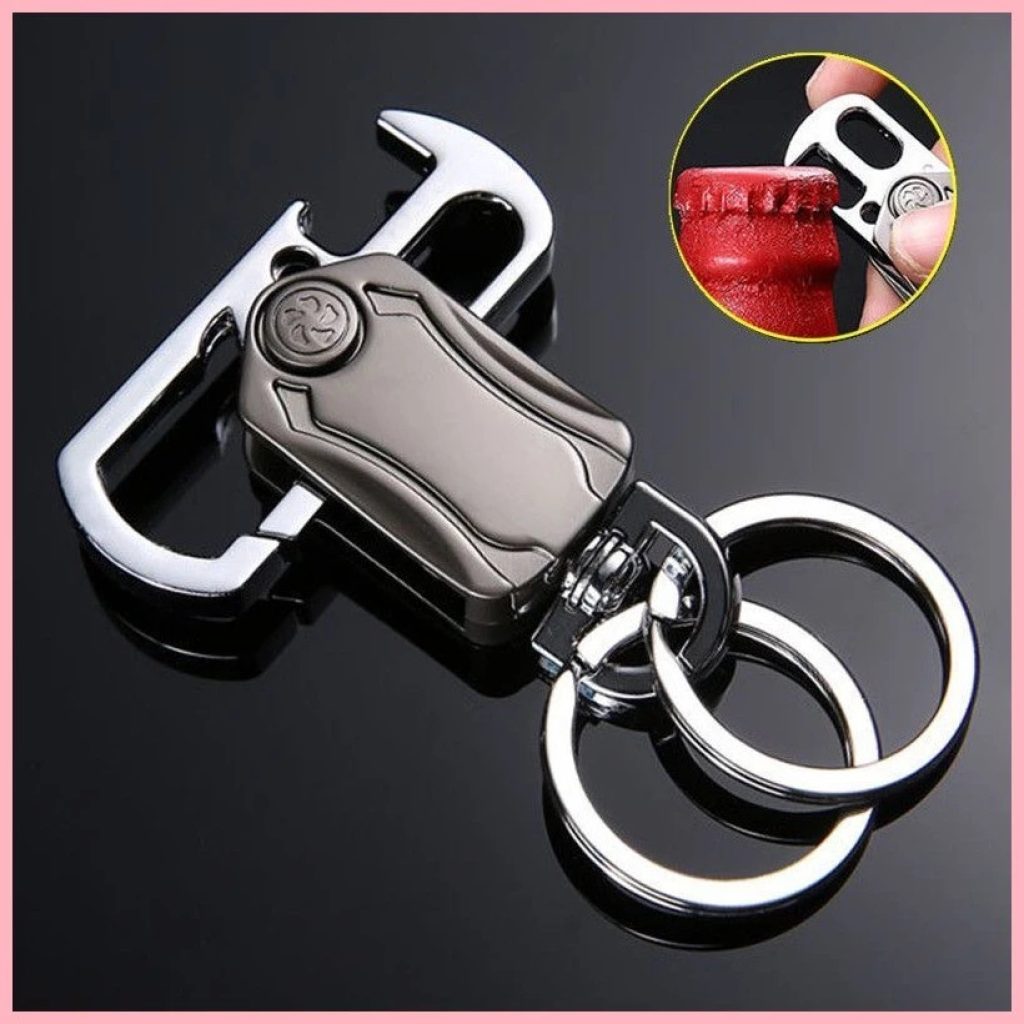 FIZZI SHOP JK SIDHU 5-in-1 keychain spinner with multiple rotating sections and compact design, shown in close-up view.