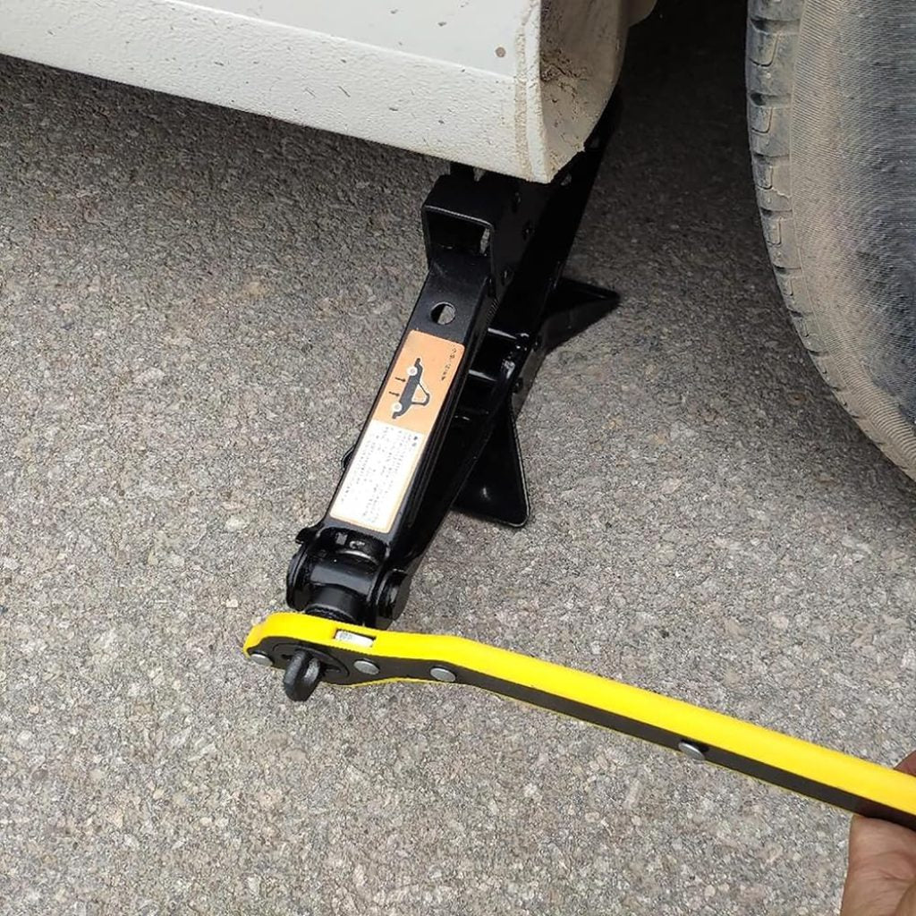 Universal car jack wrench from FIZZI SHOP JK SIDHU, showing a sturdy metal handle and adjustable mechanism for vehicle lifting.