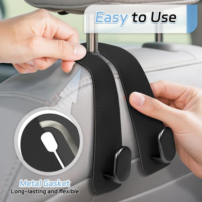 Leather car seat headrest hook by FIZZI SHOP, showing a close-up of the durable black hook attached to a leather headrest.