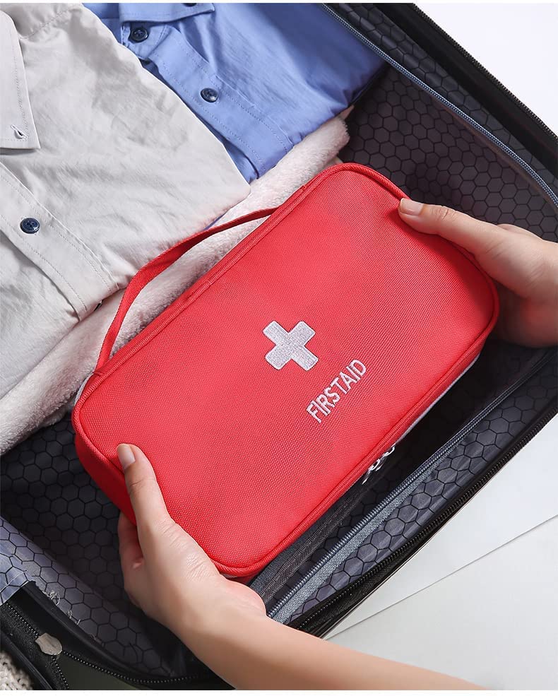First Aid Travel Medicine Pouch by FIZZI SHOP JK SIDHU showing compact medical kit with bandages and essential supplies inside.