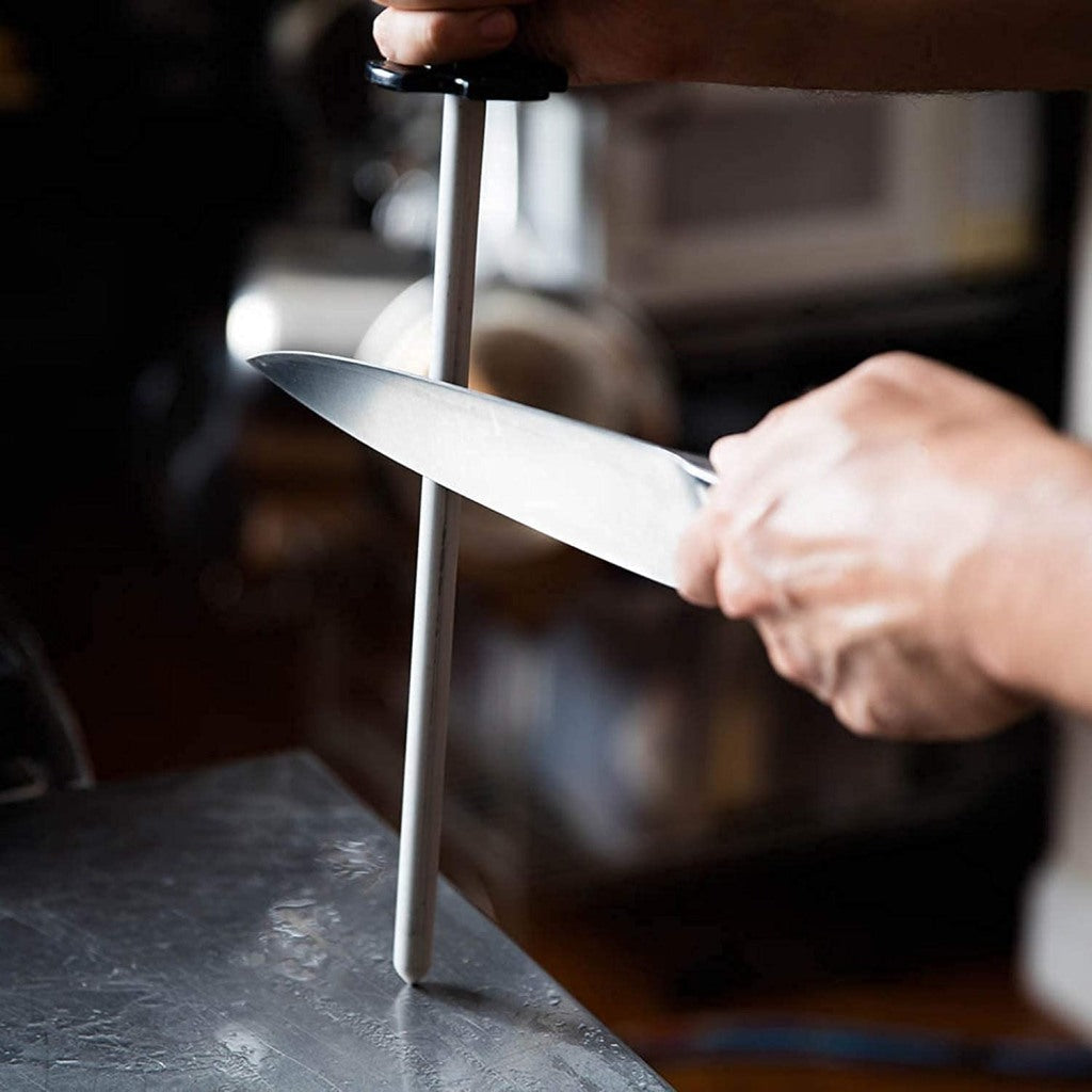 Set of 8 kitchen knives from FIZZI SHOP JK SIDHU, including chef, utility, and paring knives with black handles.