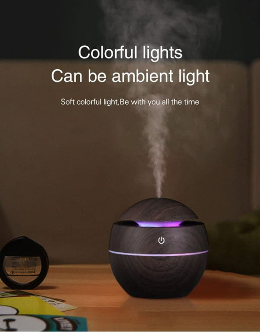 Wooden humidifier diffuser by FIZZI SHOP showing a sleek wooden design with a small water reservoir and mist outlet.